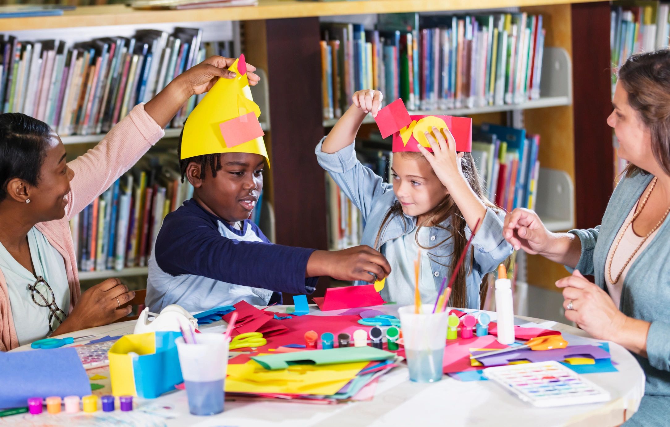 Families crafting together at a colorful table